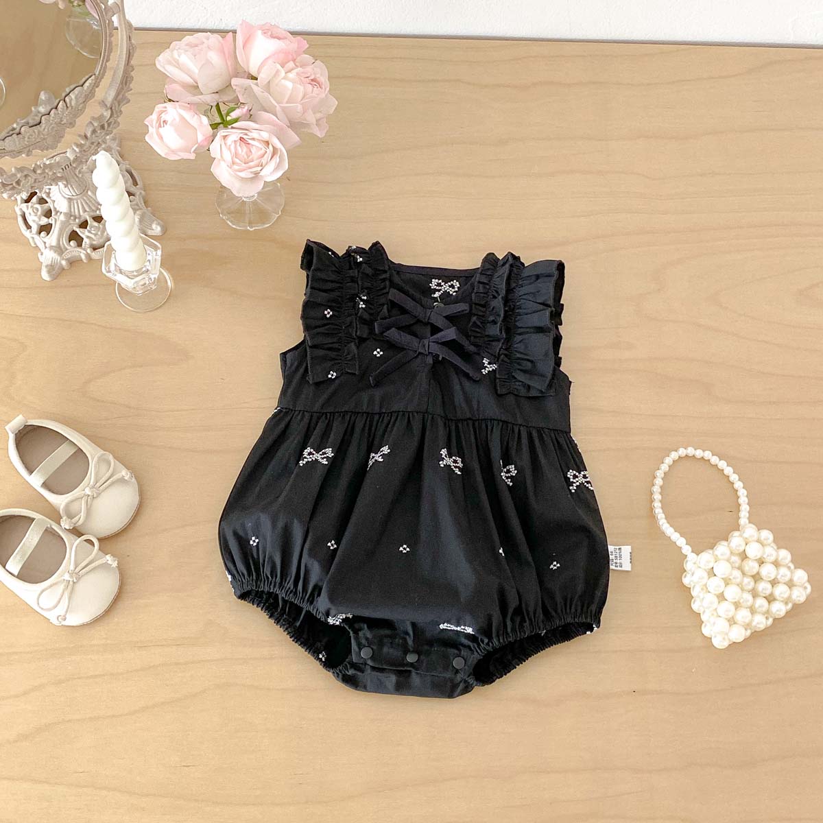 Zwarte romper met strikprint v - Baby Clothing Online recensie en prijs